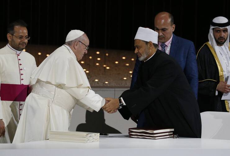 Pope Francis shakes hands with Sheik Ahmad al-Tayeb, grand imam of Egypt's Al-Azhar Mosque and University, during a document signing at an interreligious meeting at the Founder's Memorial in Abu Dhabi, United Arab Emirates, in this Feb. 4, 2019, file photo. (CNS photo/Paul Haring)